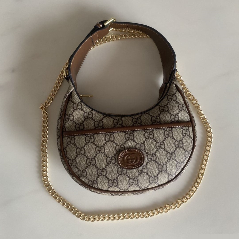 G*u*i top handle bags